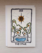 A tarot card titled 'THE STAR' with a hand-drawn style illustration, an envelope beneath.